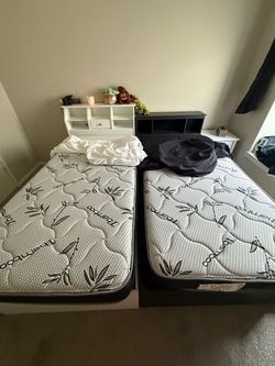Two twin size beds with brand-new mattress -$400 each