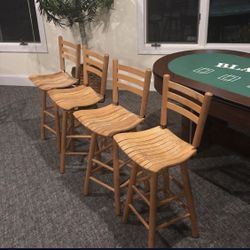 4 Wood swiveling bar stools. Nothing Wrong With them 
