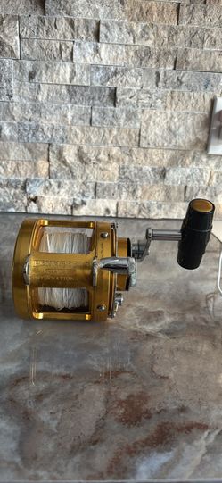 Gold PENN INTERNATIONAL 30SW TWO SPEED BIG GAME Fishing Reel with 135 lb Spectra.