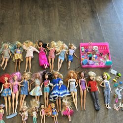 24 Barbie’s and accessories