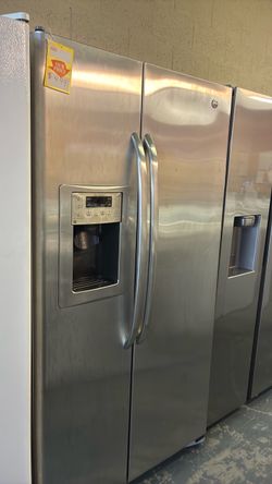 Like new GE stailenss steel side by side refrigerator