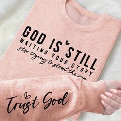 Pink sweatshirt (God’s Not Done Writing Your Story)