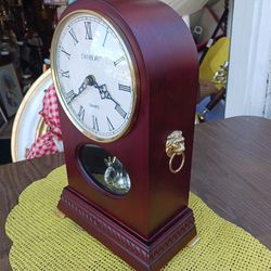  REALLY NEAT LOOKING  CLOCK  with  LIONS HEADS ON EACH SIDE 