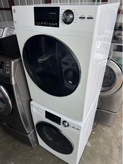 24-inch GE Stackable Front-Loading Washing Machine with Steam and Front-Load GE Electric Dryer. Dimensions: 70 inches height, 24 inches width, 25 inch