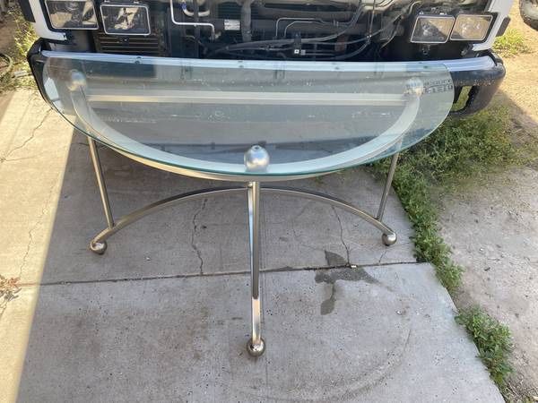 Modern contemporary entry glass and silver metal rounded table