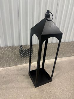 Metal candle votive holder .. 29” high $20