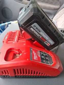 Milwaukee  18volt  brushless impact drill battery and fast charger battery and charger only used a couple times