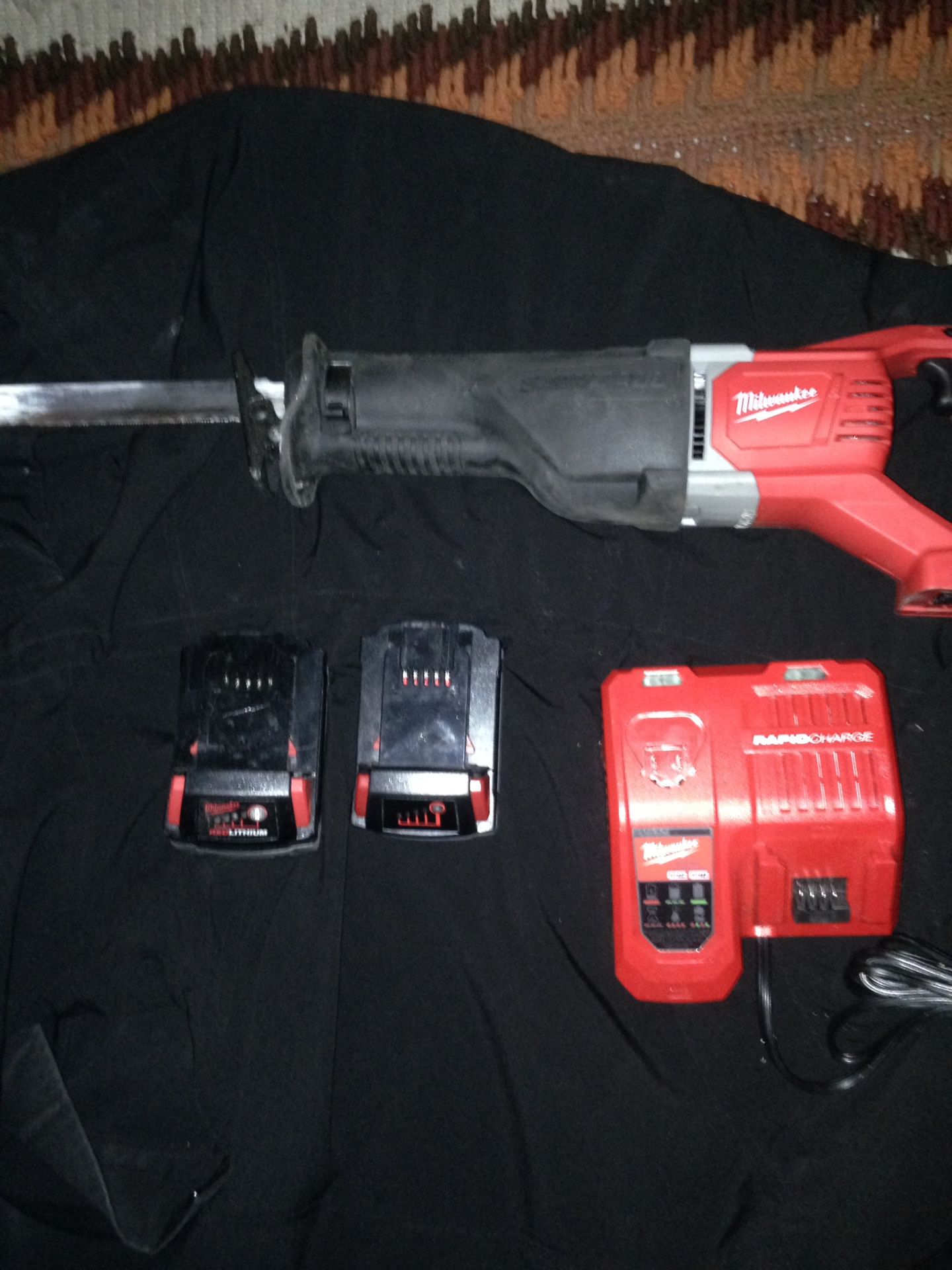 Milwaukee saws all 2 batteries and one charger