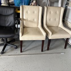 Two Dining Chairs And A Desk Chair 