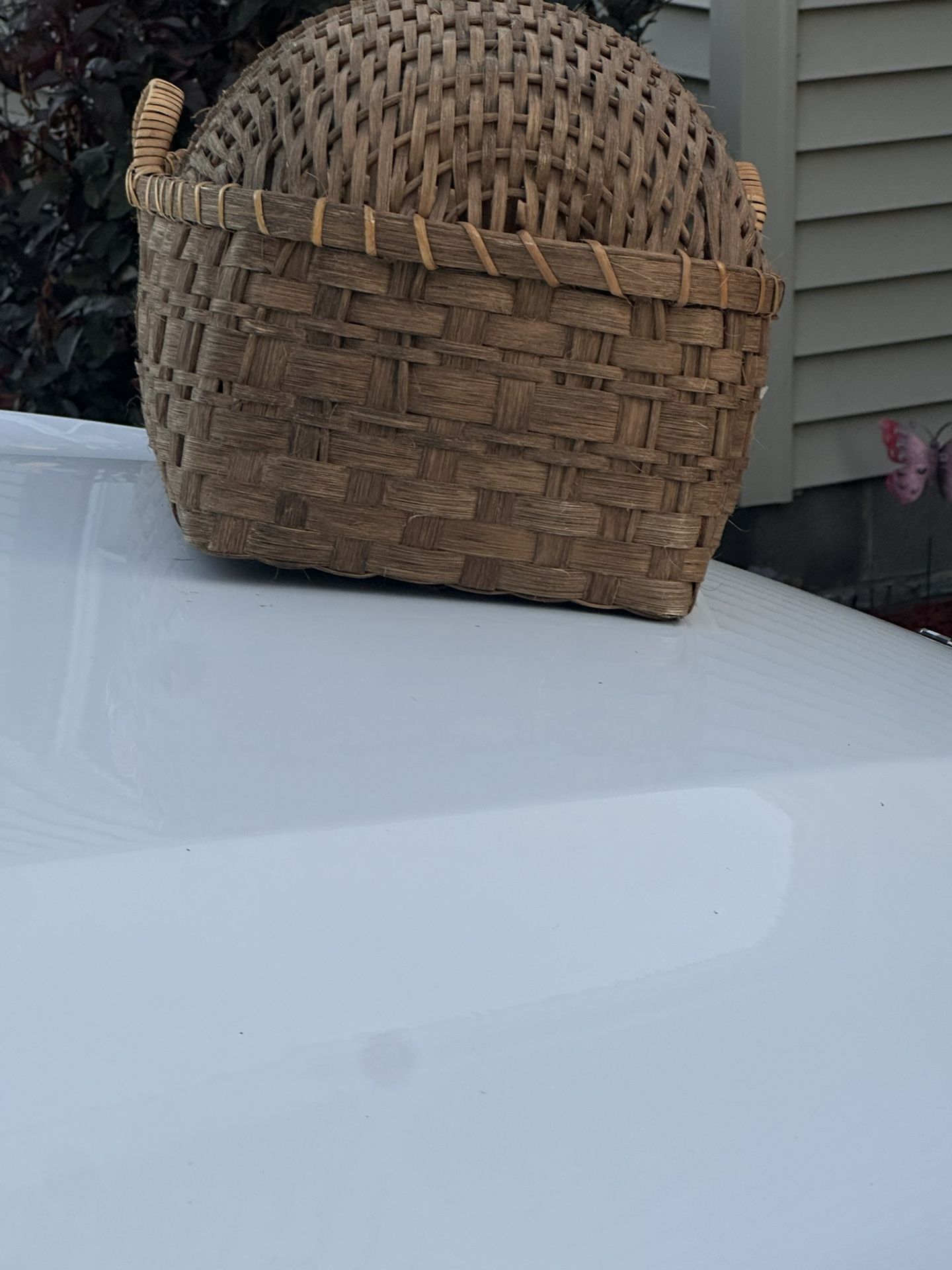 Old antique brown wicker cradle in perfect shape