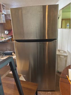 Refrigerator and washer and dryer