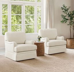 2 Cream Upholstered Swivel Armchairs