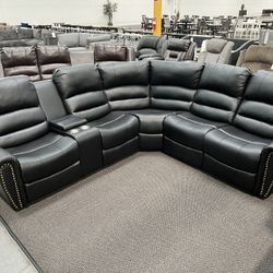 New Reclining Sectional .  Black Leather .  111” X 99”.  Free Delivery !