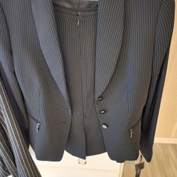 Pinstripe 2 piece suit size, 8 price tag, $280.
Will sell for30.