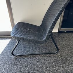 (1) Low sitting patio wicker style conversation chair and table. 