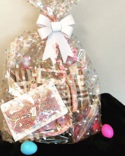 Easter basket purse with eyeshadow palette and lashes and a mask