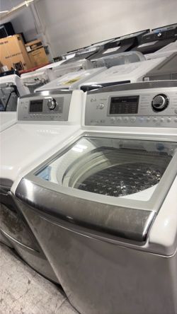 Top load washer and gas dryer