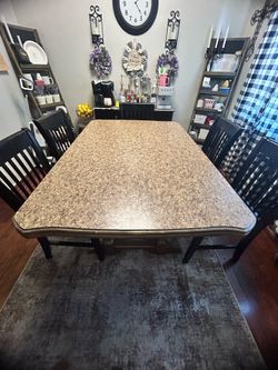 Used Rectangle table with 6 black chairs