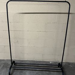 Garment Rack 43.5” W x 58” H, Base is 16” D. Can Put Shoes On Bottom. Stationary, Not On Wheels. 