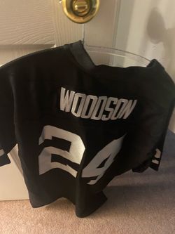 Charles Woodson XL and Marshawn Lynch M offical NFL raiders jerseys