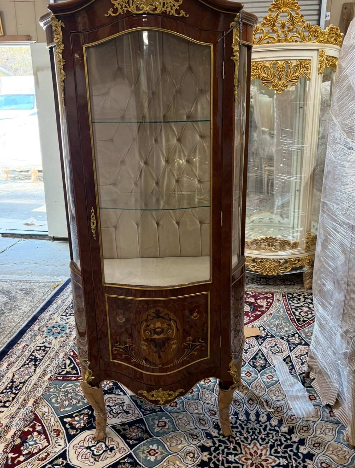 Curio Louis XVI Vitrine LOOK UP This is a Louis XVI style vitrine. TIME PERIOD Late 20th Century ORIGIN France HISTORY This vitrine is crafted in the