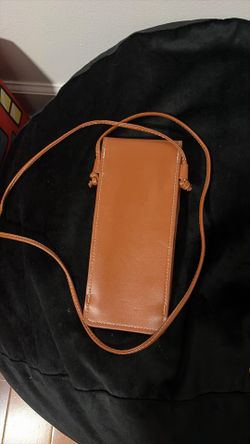 Celine leather triomphe phone pouch.