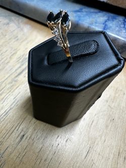 Gold Ring with Dark Stones and Clear Accents