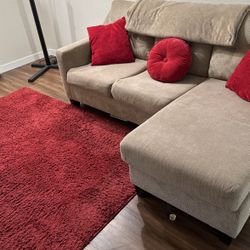 Beige L Shape Couch With Red Cushions