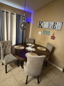 Round Wood Dining Table with 4 Tufted Chairs