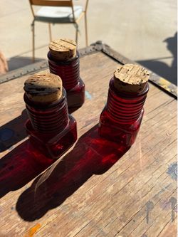Vintage red glass containers with cork tops