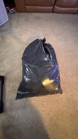 Bag full of mostly designer shoes for women