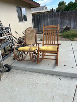 Two Wooden Rocking Chairs with Cushions