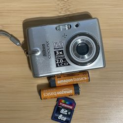 Nikon Coolpix L10 silver digital camera Tested Works  Flash zoom photo video all working. Batteries and memory card included