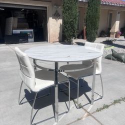 Dining Table W/ Two Chairs’! 
