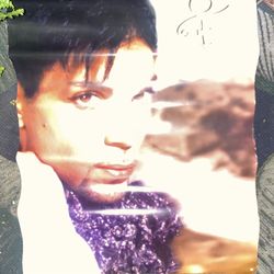 Used original promotional poster for Prince's 1996 album, Emancipation, often considered a collector's item.  The poster features a close-up portrait 