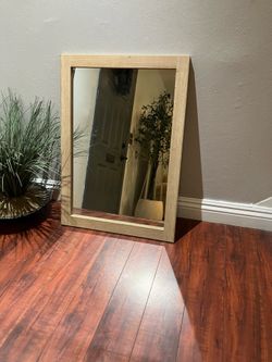 Wooden look Decorative wall mirror.