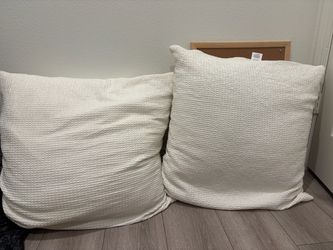 Large white decorative pillows