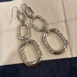 Large chain link silver tone dangling earrings bedazzled with clear bead work