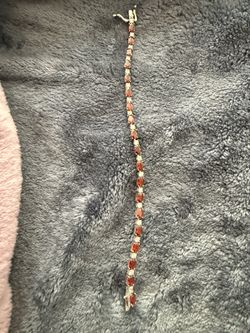 Silver and garnet tennis bracelet