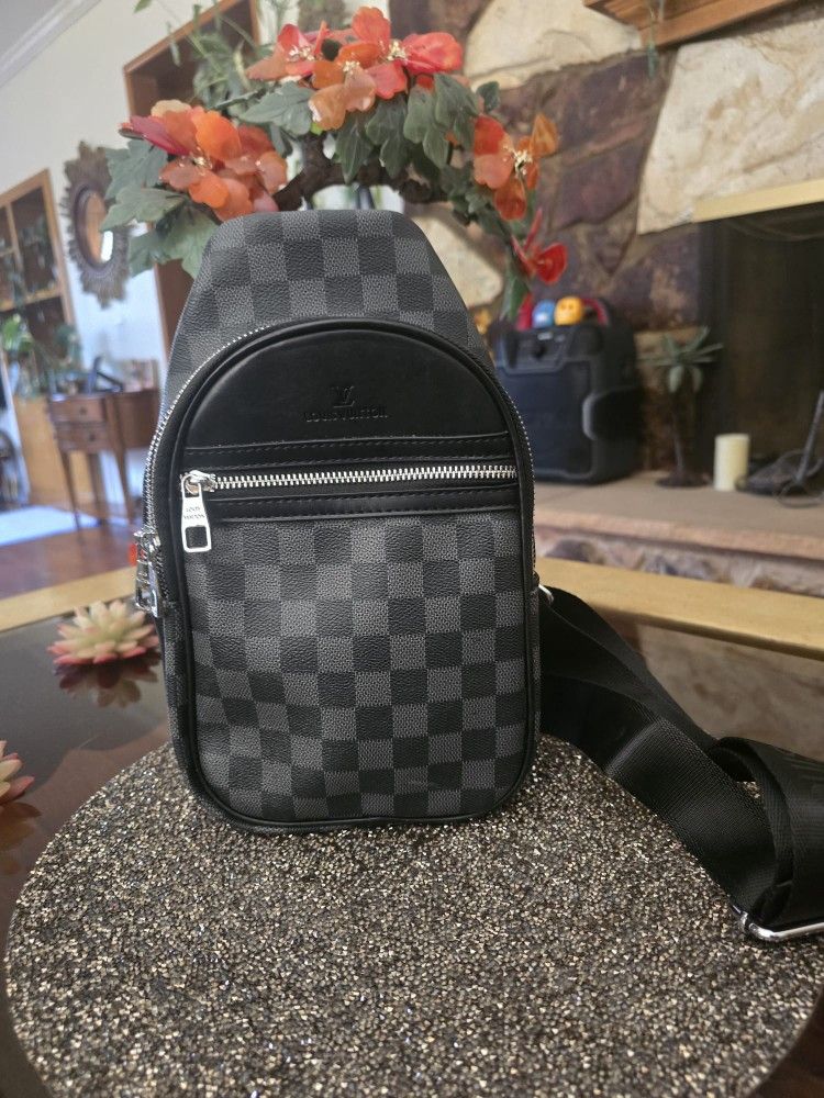 Backpack
Louis Vuitton, The Avenue Slingbag is made from Damier Graphite canvas with a Louis Vuitton Paris leather patch on the front outside pocket,