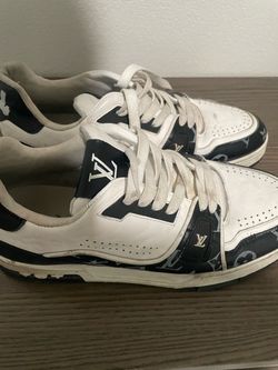 Louis Vuitton LV Trainer sneakers in a black-and-white Monogram colorway.