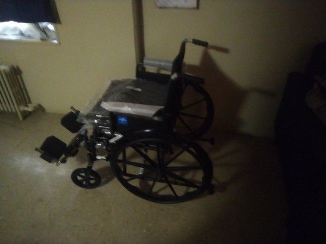 Like New Wheel Chair With Feet Rest And New Manuel And Seat Belt And Two Seat Cushions And A Tool For The Wheel Chair