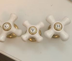 Vintage Porcelain Cross-handle faucet knobs with brass trim, "C", "H", and " Center