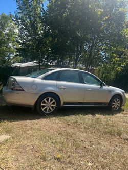 Silver Ford Taurus 4-Door Sedan