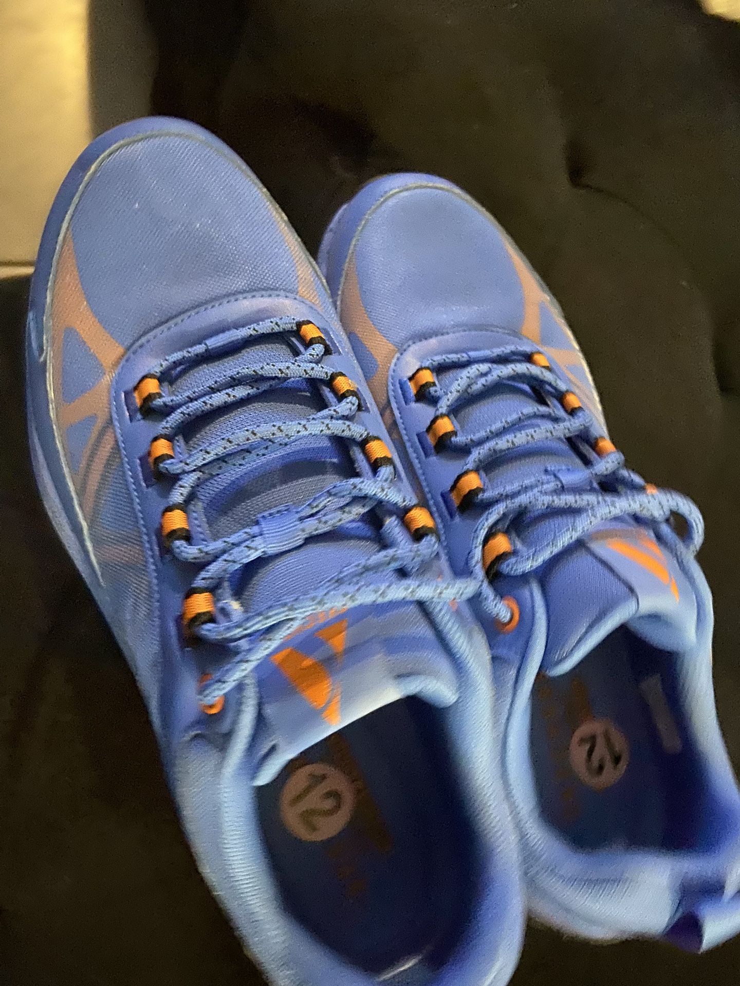 New Men Blue athletic shoes with orange accents, size 12. $30 Located Mount Dora Fla 32757