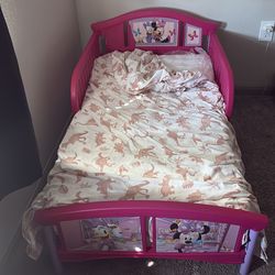 Toddler bed with covered mattress