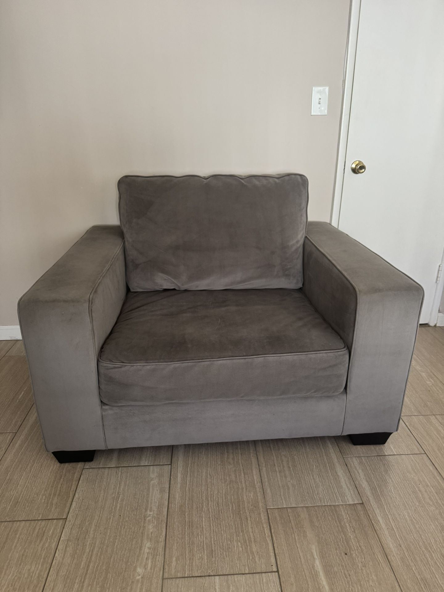 Large grey velvet armchair 