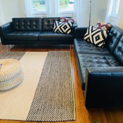 2 mid century modern black leather sofas with metal legs. excellent condition.