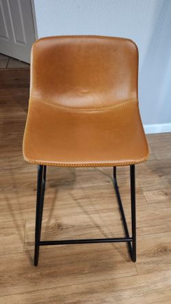 Tan Faux Leather counter stool with black metal legs..I have 4, $50 each