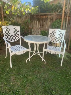 VINTAGE TABLE AND 2 CHAIRS WITH ORIGINAL GLASS TOP. 